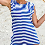 First pic of Nude In her striped beach dress and matching pigtails, Calli shows off her fun and playful appeal in a beach photo shoot