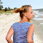 Fourth pic of Nude In her striped beach dress and matching pigtails, Calli shows off her fun and playful appeal in a beach photo shoot