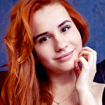 First pic of Nude Redhead Nicole La Cray sensually strips her black lingerie on the bed.