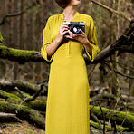 Second pic of Nude Dakota A took pictures of her delectable pussy in the forest.