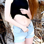 Second pic of Nude Lena Flora strips on the sand baring her creamy body.