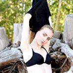 Third pic of Nude Lena Flora strips on the sand baring her creamy body.
