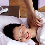 First pic of Nude Iva sensually poses on the bed as she bares her petite body.