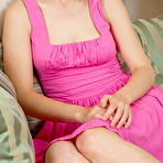 First pic of Nude Xena sensually strips on the sofa baring her pink nipples and pink pussy.