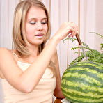 First pic of Astonishing angel is sitting on the table with a sappy red watermelon, which excited her so much that she started self-service. gallery