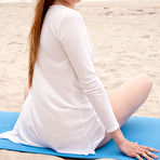 Second pic of Nude New model Matilda Sun displays her sexy, flexible body on the sandy beach.