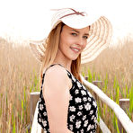 Fourth pic of Nude Dominika Jule shows off her delectable, creamy body as she poses outdoors.