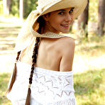 Second pic of Brunette posing outdoors