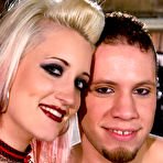 First pic of Blonde domme Kimberly Kane in red latex outfit and black fishnet stockings fucks Wolf Hudson