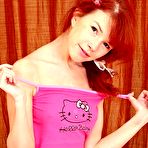 Third pic of Hottest A horny redhead masturbating her slippery pussy with fingers by ShavedTeenGirls.com