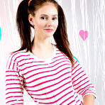 Third pic of Hottest Adorable looking brunette model starts to tease us in her nice small clothing before almost taking of her bras. by ShavedTeenGirls.com