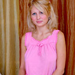 First pic of Lovely blonde girl proudly displays a set of her sweet breasts while posing on the bed. free pictures