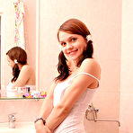 First pic of She have a passion for posing nude, this time she decided to undress in the bathroom - admire her fresh, slender body and innocent smile. free pictures