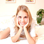 Second pic of Insatiable hot lass is sitting on her bedroom in pink panties on strings, which she unties for demonstrating her marvelous beaver. free pictures