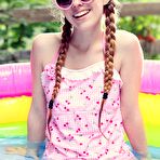 First pic of Hot redhead teen Dolly Little getting wet outside