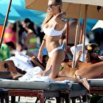 Third pic of Laura Cremaschi in white bikini on a beach