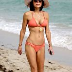 First pic of Bethenny Frankel in a peach bikini on a beach