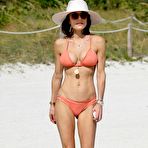Fourth pic of Bethenny Frankel in a peach bikini on a beach