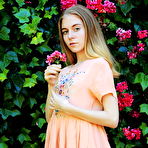 First pic of Shayla flaunts her nubile body as she strips at the garden. naked