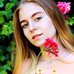 Second pic of Shayla flaunts her nubile body as she strips at the garden. naked