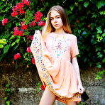 Fourth pic of Shayla flaunts her nubile body as she strips at the garden. naked