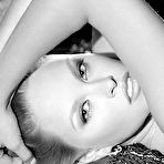 Fourth pic of Get an eyeful of the fair skin and soft curves that Kitty Fox brings to the table. She's hot as hell in booty shorts and a crop top t-shirt, but even better when she's down to just her thong. She's sweet, sexy, and eager to show off the dripping delight of her bald pussy. naked