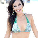 Third pic of Lisa Opie in various bikinies on a beach