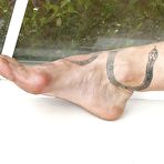 Second pic of Delta Hauser bends over and shows her lovely assets