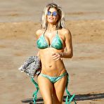 Third pic of Stacy Ferguson in geen bikini on a beach