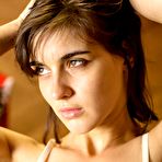 Second pic of Brunette girl Leonda A strips and shows small boobs with the hairy beaver