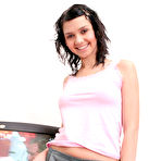 Third pic of Gorgeous teen girl undresses in front of the TV set switched on, it is much more exciting to watch her posing nude than the telecast free pictures