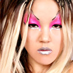 Fourth pic of Tight tiny titted asian Miko with amazing make-up poses in silver boots