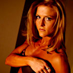 First pic of Slim sexy muscle lady Jaime Franklin in black lingerie poses in the semi-dark of the bedroom