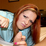 Second pic of Rebecca Ryder makes her eyes on camera as she gives painful handjob from your point of view