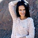 First pic of Lada A removes her seethrough shirt next to giant rocks