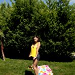 First pic of Sweet brunette Henessy Nubiles is all alone outside and she is getting nude and frisky quickly