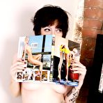 Fourth pic of Topless brunette chick Hollywood demonstrates her tattoos and bare tits