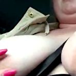 Third pic of Busty chubby Danish babe titties flashing while driving at AmateurPorn.me