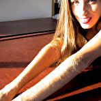 Third pic of Lori Anderson gives a smile and makes her playful eyes on you as she shows off her hairy arms