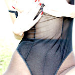 Second pic of Brunette milf outdoors wearing black styling pantyhose negligee and shoes, entertainment in posing strip tease fondle