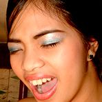 Fourth pic of Young Filipina strapped in sex swing has her asshole punctured by other girl