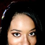 First pic of Latina bimbo Aliana Love smiles playing with cock sticking out of the glory hole