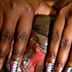 Third pic of Black and busty Luxury Amore loves her interracial sex, especially if it's through a gloryhole.