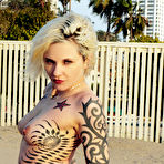 First pic of Inked up blonde Voltaire strips nude and goes on the swings in her bare skin