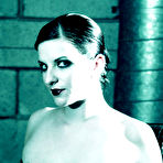 First pic of Big titted alt model Alsana Sin poses in Halloween hat with skull in hands