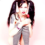 Third pic of Tattooed goth girl with lollipop Kellie Laplegua strips to show her pierced pussy and tits
