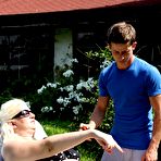 First pic of Mature blonde BBW face sits the neighbours boy after he applies suntan lotion - PornPics.com