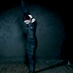 Fourth pic of SexPreviews - Lola Fae petite pigtails redhead is bound in metal and strapped in kinky dungeon