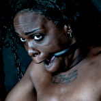 Second pic of SexPreviews - Bellah Dahl curly ebony in leather is spread bound for spanking in dungeon