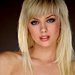 Fourth pic of Cuddly tattooed blonde Emma Mae poses in black lingerie and opaque stockings